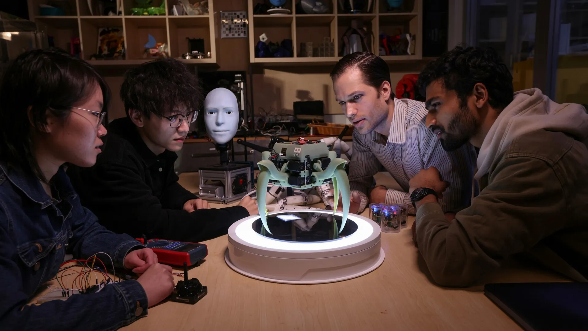 Students and faculty working on a research and development in the Creative Machines Lab.