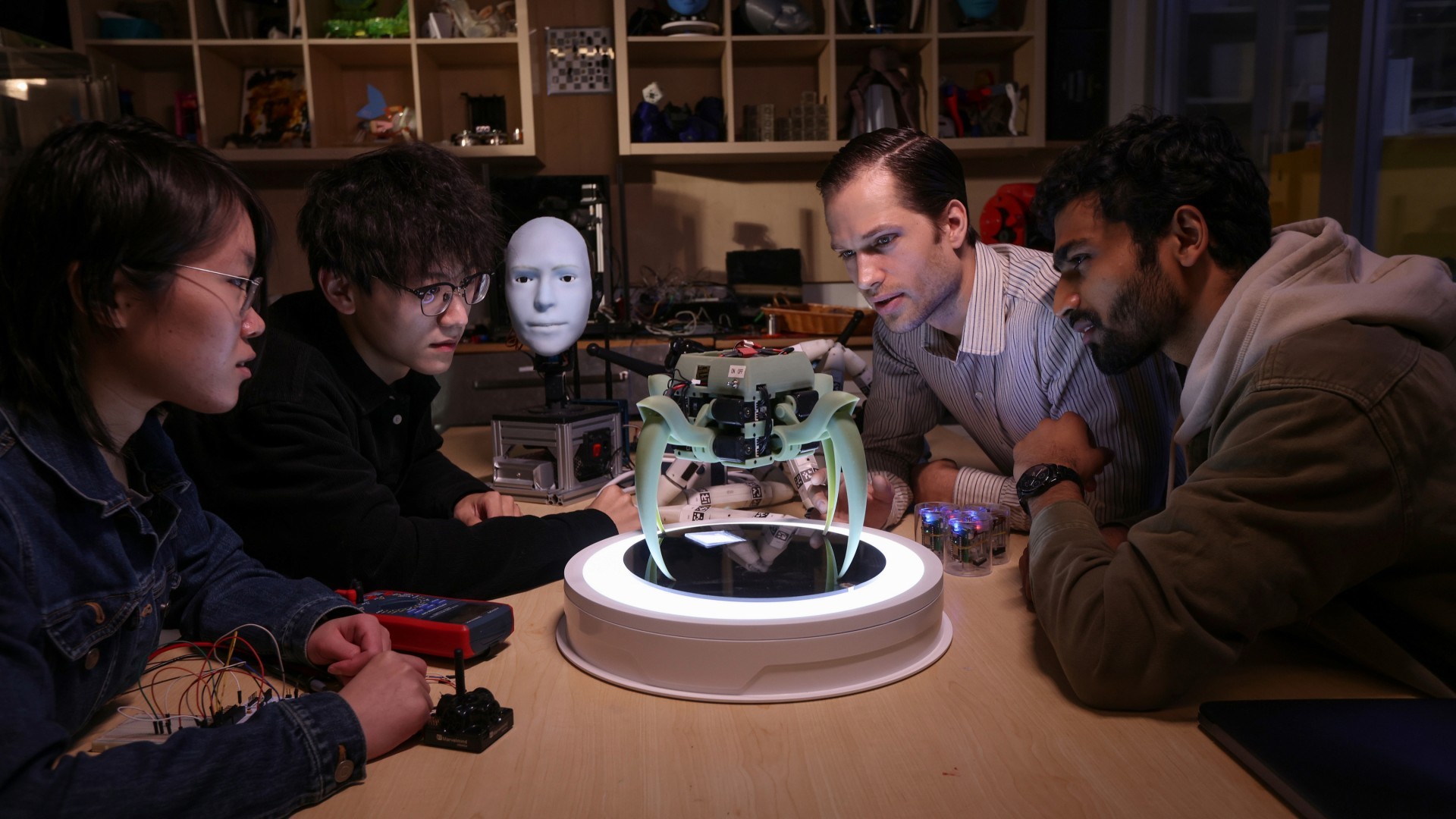 Students and faculty working on a research and development in the Creative Machines Lab.